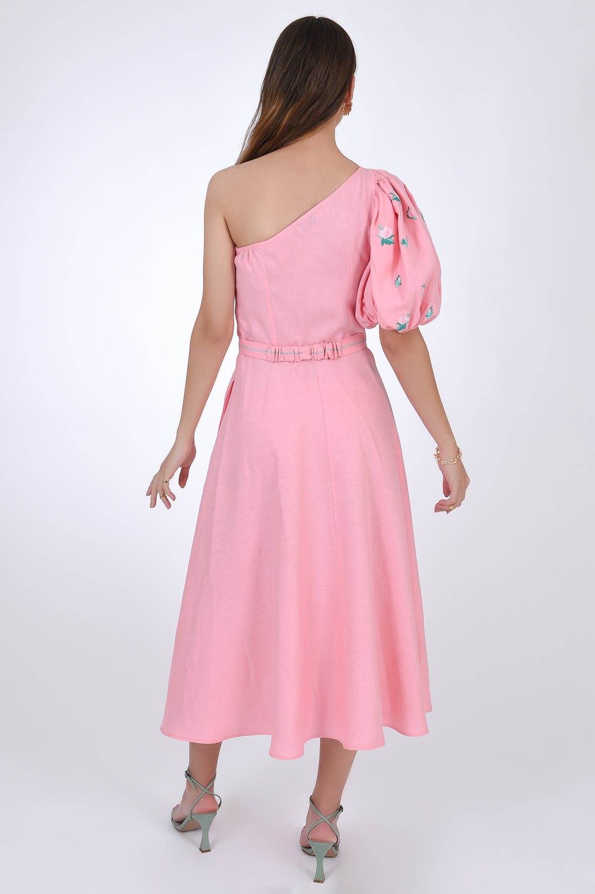 Fanm Mon Ayisha Midi Linen one shoulder Dress, bacl view. Featuring a puff sleeve one shoulder design with embroidered floral pattern.
