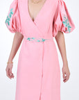 Luti Front detail view showcasing embroidery detail on sleeves and detectable belt.