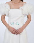 Detail of the waist embroidery and tulle sleeves