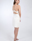 Arel 100% Linen Mini Dress side view of the embroidery detail and tie back.