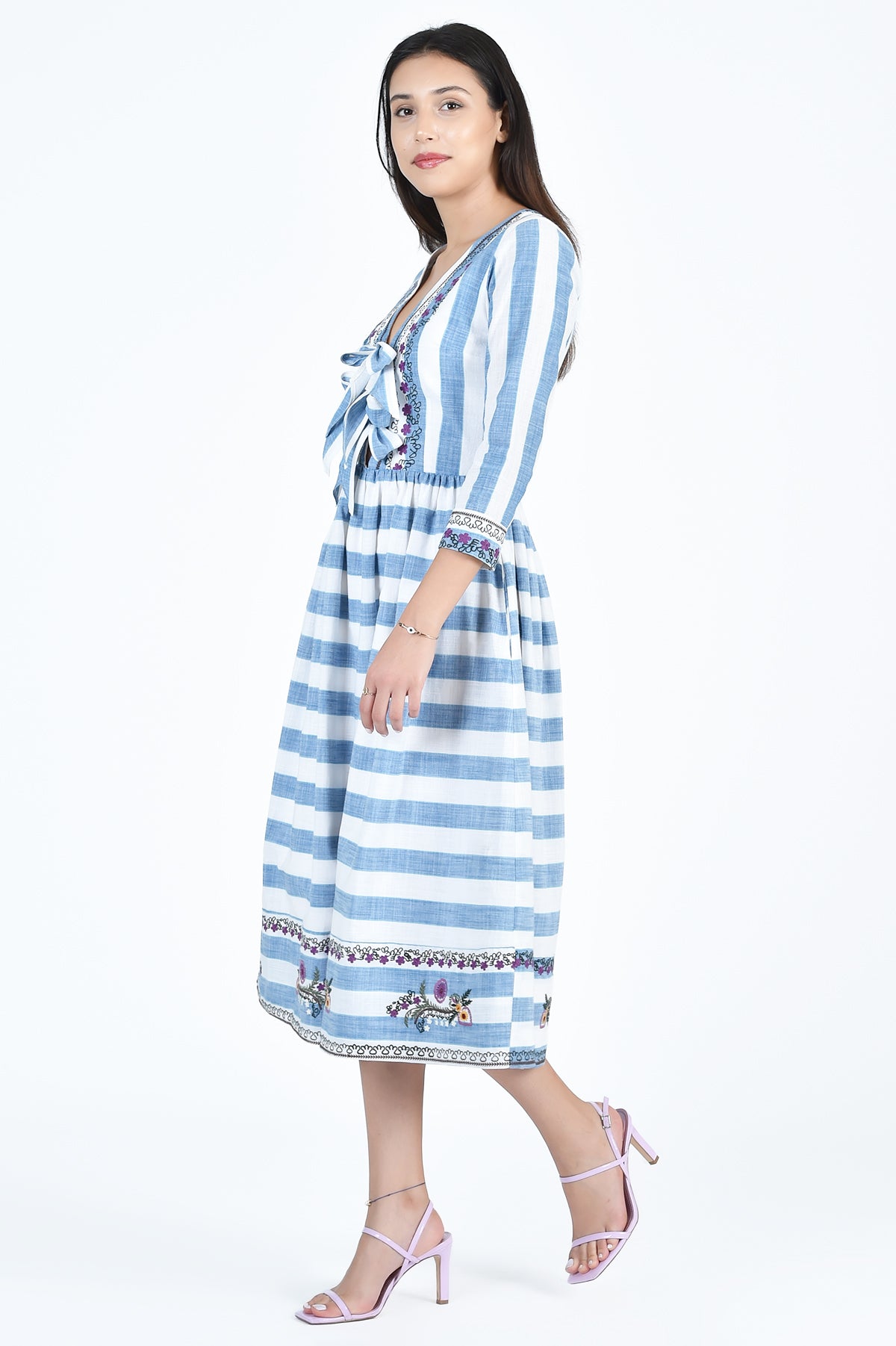 Souci Dress Side View showcasing Floral embroidery details on Hem and Cuff (Fanm Mon Dress Part of The Wombman Collection)