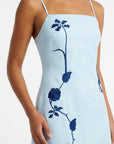 Close-up of the Carmen Dress highlighting intricate floral vine embroidery inspired by climbing garden blooms.