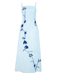 Carmen Dress by Fanm Mon featuring botanical floral embroidery cascading across an elegant maxi-length silhouette.