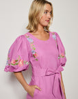 Fanm mon Kongo dress in deep plum cotton with floral embroidery.