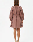 Back view of the Fanm Mon Hayal Dress featuring equestrian-inspired embroidery, voluminous sleeves, and a self-tie waist belt.