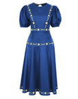 Fanm Mon Lesley Dress featuring hand-embroidered daisy vines, a classic crew neckline, puff short sleeves, a fitted bodice, and an elegant A-line midi silhouette in indigo blue.