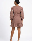 Fanm Mon Noen Dress back view featuring embroidered blouson sleeves, braided waist belt and ruffled mini hem.