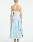 Back view of Fanm Mon Paola Dress with adjustable straps, fitted bodice, and flowing gathered midi skirt with floral embroidery.
