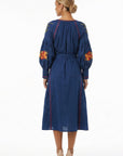 Back view of the Fanm Mon Raya Dress featuring voluminous embroidered sleeves, contrast stitching, and a self-tie waist.
