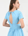 Tucce Linen Dress Detail View, showcasing tie back gathered neck and cutouts.