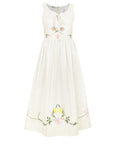 Fanm Mon Veda Dress featuring hand-embroidered tulips, cosmos, buttercups, and climbing floral vines on a gathered-neck midi silhouette.