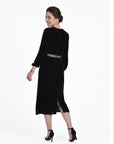 Fanm Mon Ezgi Dress back view in black velvet featuring long sleeves, embroidered waist detail and a midi silhouette with side slit