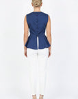Back view of Fanm Mon Marena peplum top in deep blue with fabric-covered buttons