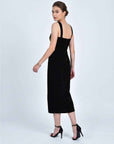 Fanm Mon Meltem Dress back view in black velvet featuring wide shoulder straps, a fitted silhouette, back zipper and midi length