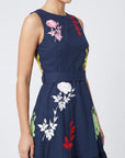 Detail of Fanm Mon Mihrap Dress with pink, red and white botanical embroidery and defined waist