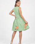 Back view of the Fanm Mon Seher Dress with a fitted sleeveless bodice, gathered skirt and floral embroidery along the hem