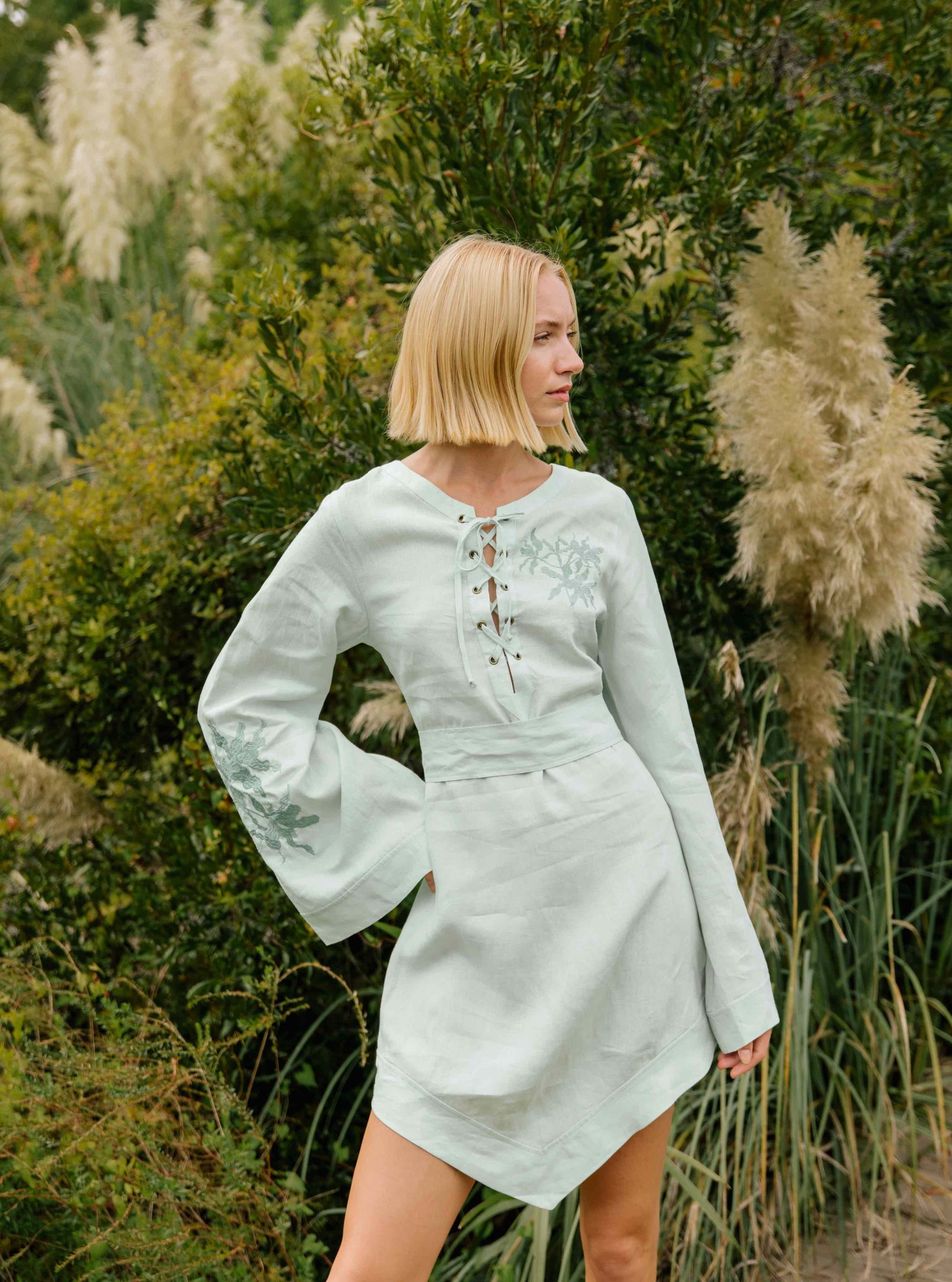 FANM MON LIFESTYLE BOZE DRESS IMAGE. Kaftan Style Linen Dress with wide kimono embroidered sleeves and handkerchief hem and tie front.  Easy slip-on wear,  mini length loose fit dress. 