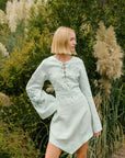 FANM MON LIFESTYLE BOZE DRESS IMAGE. Kaftan Style Linen Dress with wide kimono embroidered sleeves and handkerchief hem and tie front. Easy slip-on wear, mini length loose fit dress.