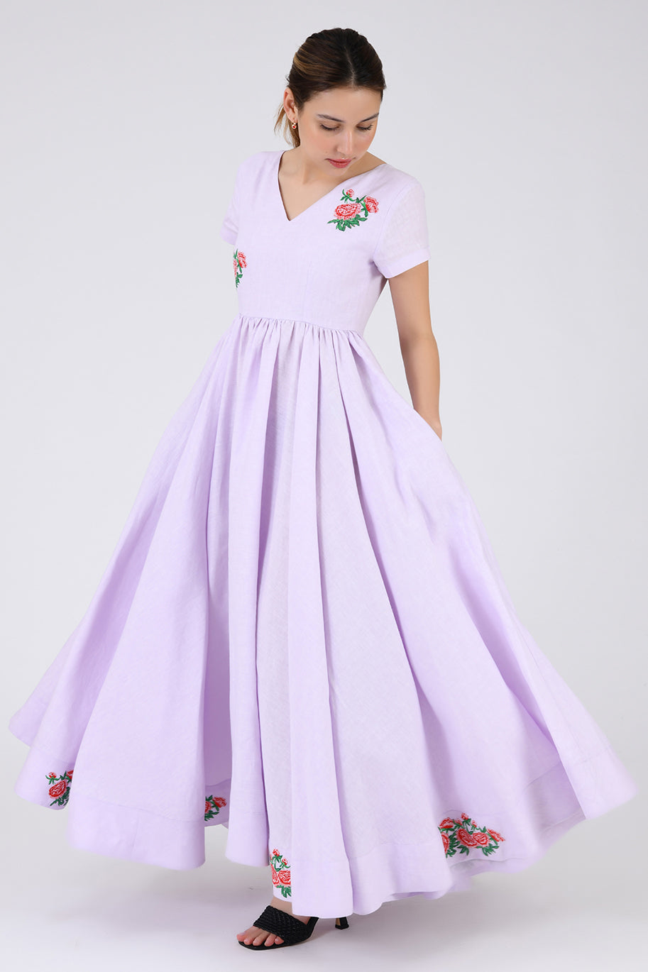 Side View of The Artem Dress Showcasing the full pleated Skirt 