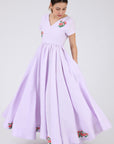 Side View of The Artem Dress Showcasing the full pleated Skirt