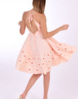 Fanm Mon Mella Dress, Back View. Showcases back tie and zipper closure, embroidery detail and movement of the fabric.