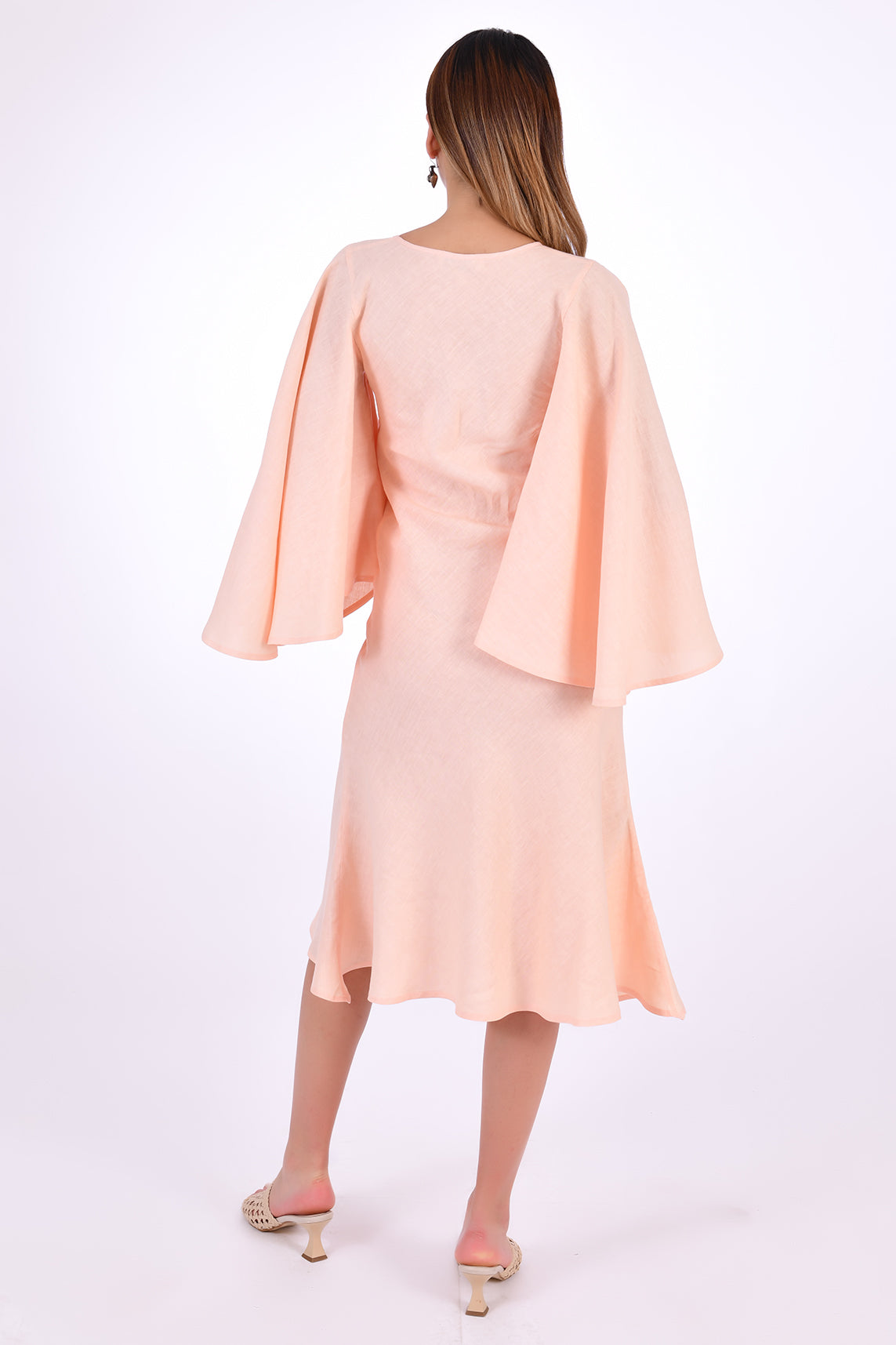 Fanm Mon Dayna Linen Dress Back view. Showcasing Kimono Sleeve bell and hem line.