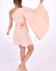 Fanm Mon Kame Linen Dress, showcasing back view with back embroidery detail and one shoulder bell sleeve.