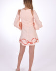 Fanm Mon Gizem Linen Mini Dress, showcasing back view with open shoulder detail and embroidery on hem.