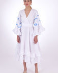 Fanm Mon Hati Linen Midi Dress, Made to Measure. Features a v-neckline, bell ruffle sleeves with embroidery detail, (Front View)