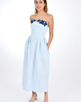 Fanm Mon Linen Lorr Dress in Light Lagoon, flaunts a sheath strapless silhouette embellished with hand-embroidered floral appliques in harmonizing hues along the neckline. Front View.
