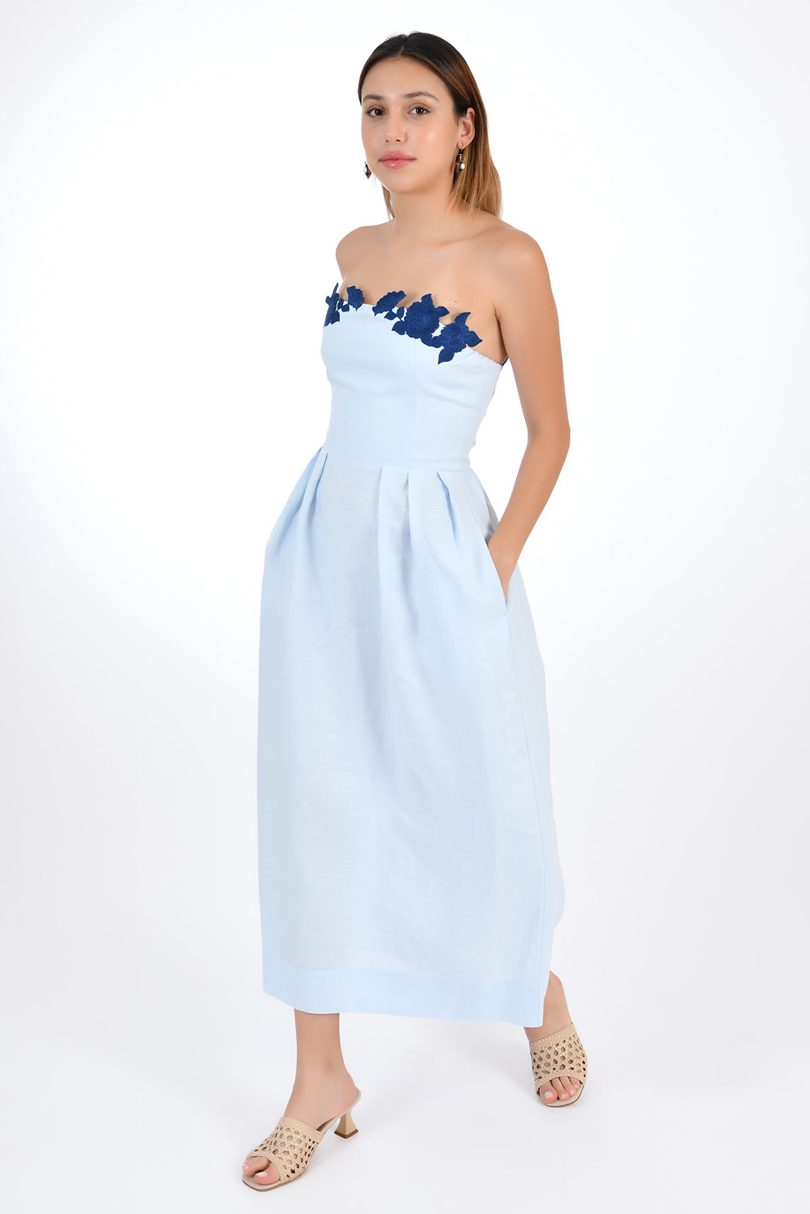 Fanm Mon Linen Lorr Midi Dress in Light Lagoon, showcasing hand-embroidered floral appliques in harmonizing hues along the neckline. Side View.