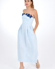 Fanm Mon Linen Lorr Midi Dress in Light Lagoon, showcasing hand-embroidered floral appliques in harmonizing hues along the neckline. Side View.
