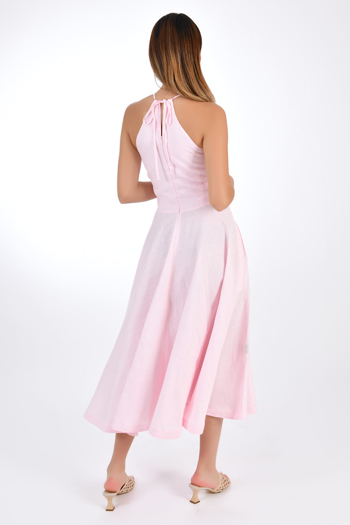 Fanm Mon Fuse Halter Linen Dress. Back view, showcasing tie neck and back zipper closure. 