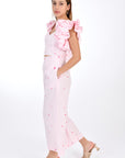 FANM MON ANAIS 2 Piece Linen Top and Pants Set. Side View, showcasing sleeveless top ruffles with intricate embroidery detail and on-seam pockets featured on wide-leg pants that boast a matching embroidery detail for a cohesive look.