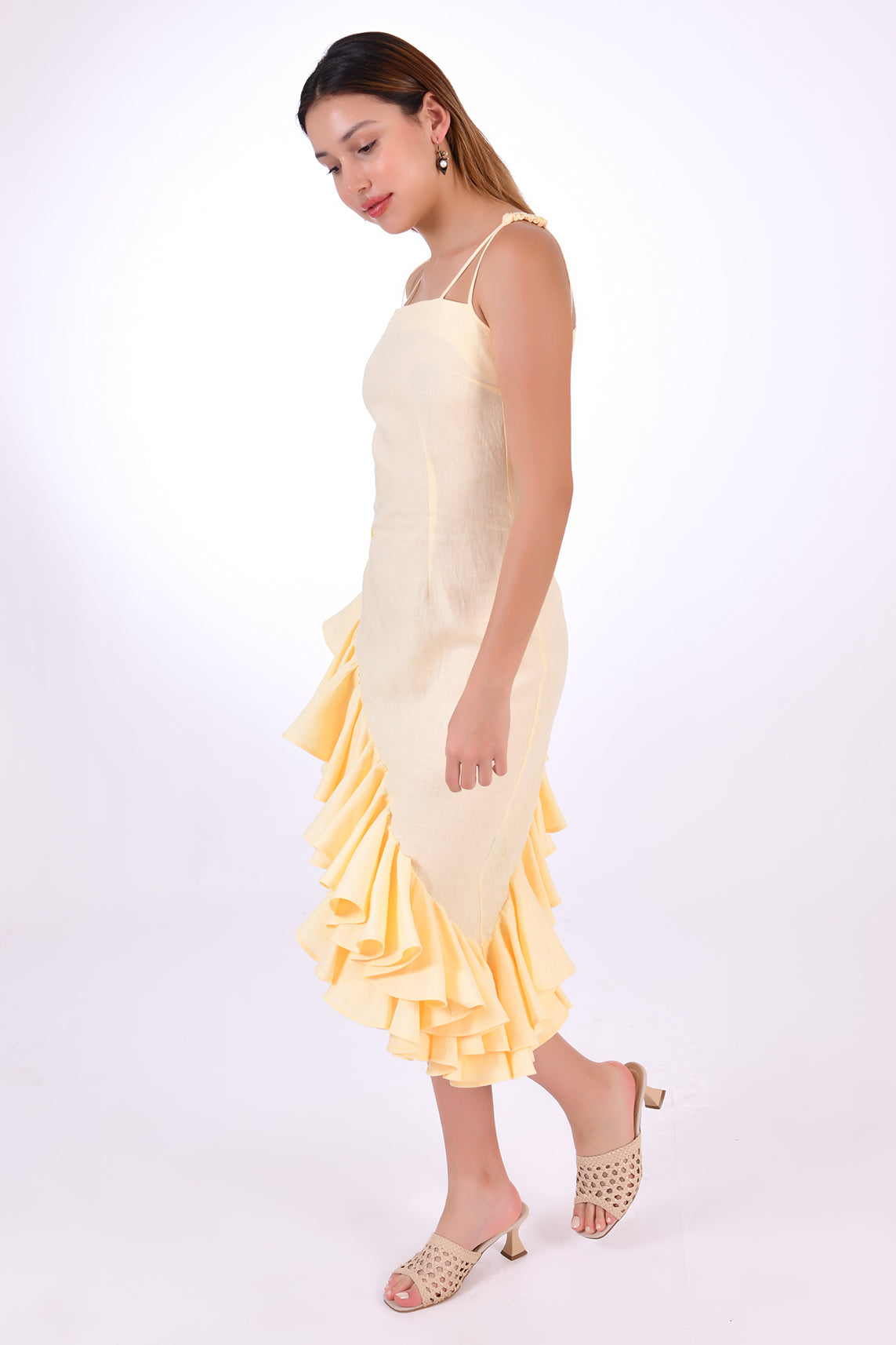 Fanm Mon Freda Midi Linen Dress, with flared asymmetrical ruffled hemline. (Side View)