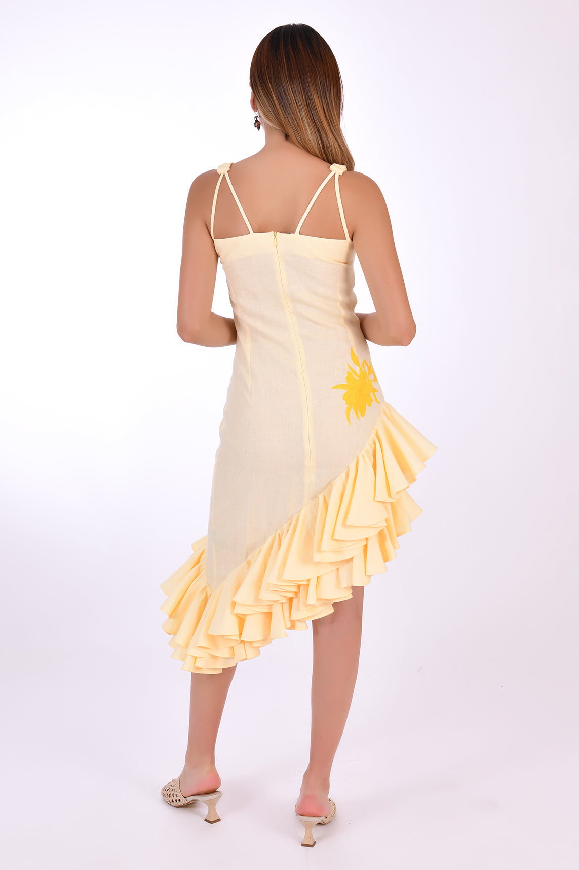 Fanm Mon Freda Midi Linen Dress, with flared asymmetrical ruffled hemline. (Back View)