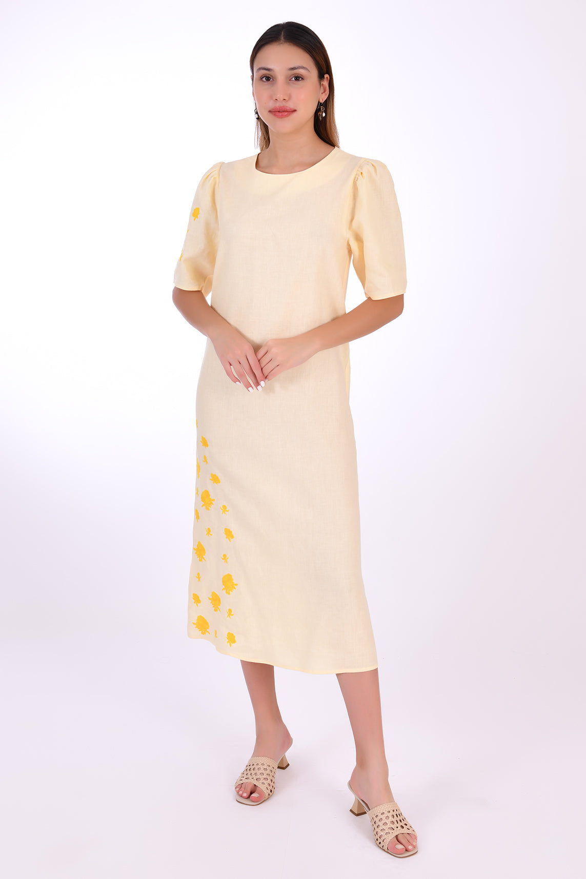 Doga Midi Linen Dress, Front View. Featuring a peephole open back and button closure. Round neck, with a belt for the waist (can be worn with or without), and features front embroidery detail.