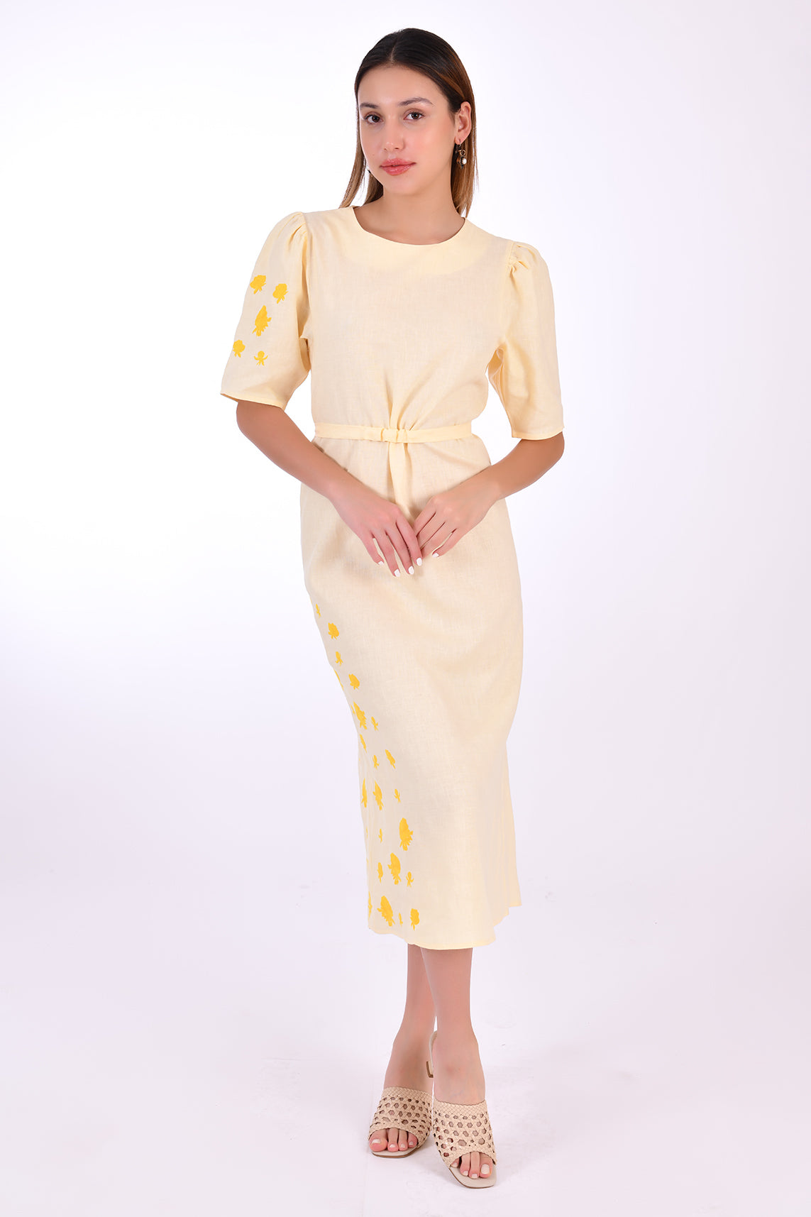 Fanm Mon Doga Midi Linen Dress, Front View Belted. Short Sleeve 100% Linen Dress, featuring a peephole open back and button closure. Round neck, with a belt for the waist (can be worn with or without), and features front embroidery detail.