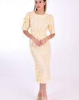 Fanm Mon Doga Midi Linen Dress, Front View Belted. Short Sleeve 100% Linen Dress, featuring a peephole open back and button closure. Round neck, with a belt for the waist (can be worn with or without), and features front embroidery detail.