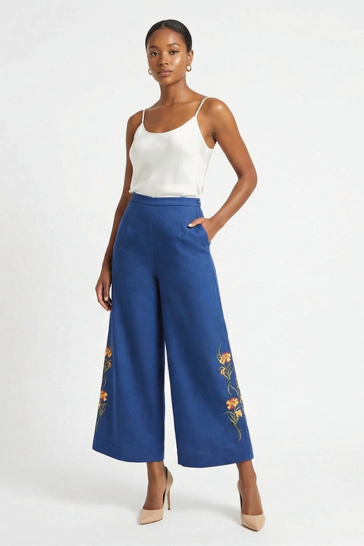 Fanm Mon Arel Pant on model featuring a high-rise fit, wide cropped legs, side pockets and floral embroidery