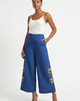 Fanm Mon Arel Pant on model featuring a high-rise fit, wide cropped legs, side pockets and floral embroidery