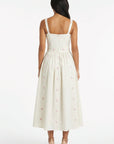 Back view of the Fanm Mon Arya Dress showcasing embroidered hydrangea details and a full midi silhouette.