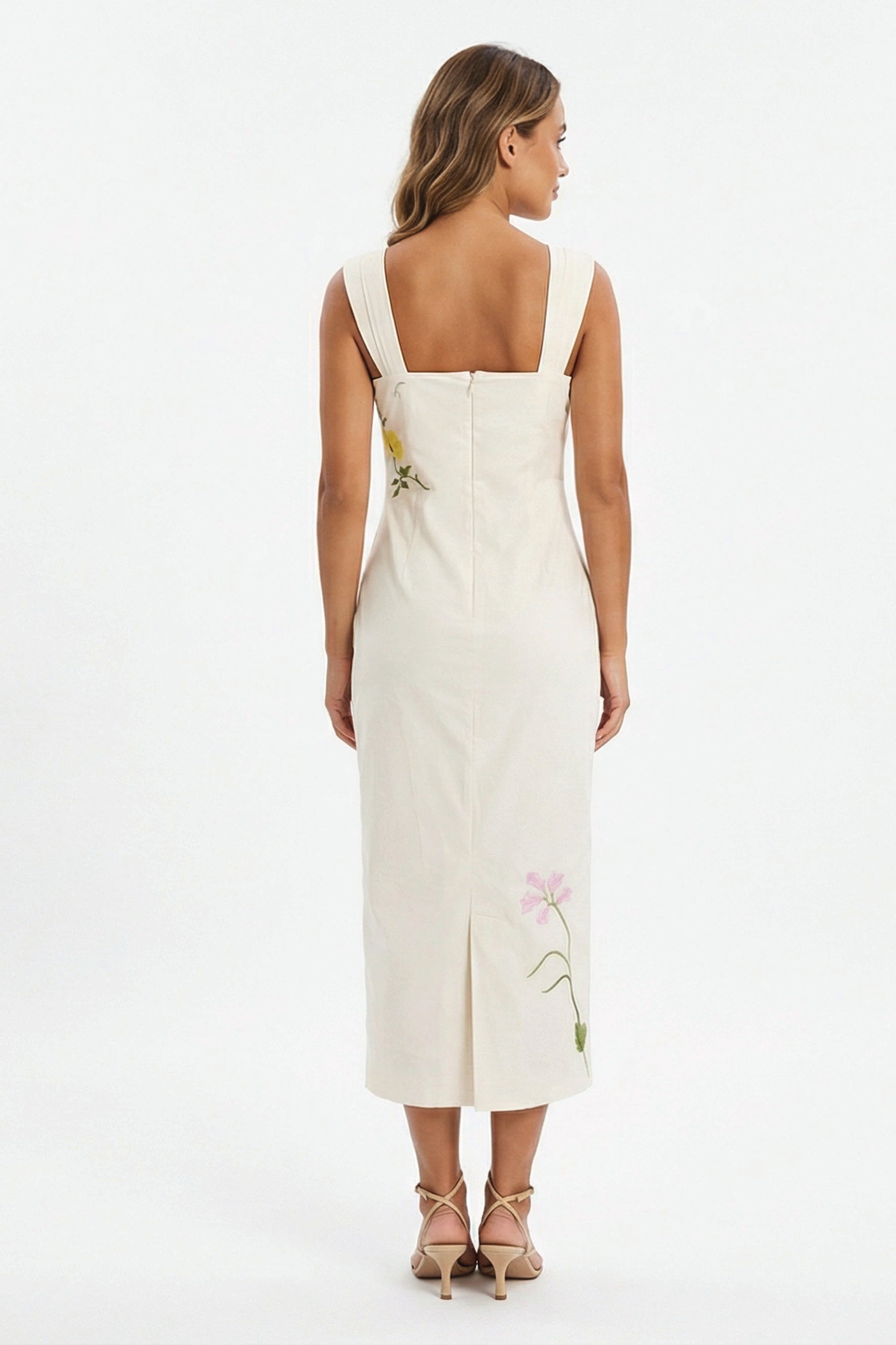 Back view of the Fanm Mon Bafra Dress showcasing the fitted silhouette, back slit, and floral embroidery detailing.