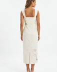 Back view of the Fanm Mon Bafra Dress showcasing the fitted silhouette, back slit, and floral embroidery detailing.
