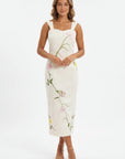 Fanm Mon Bafra Dress featuring botanical floral embroidery, a sweetheart neckline, wide straps, and an elegant column silhouette.