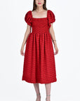 Buse Dress Showcasing on-shoulder puff sleeves and front square neckline with smocking details