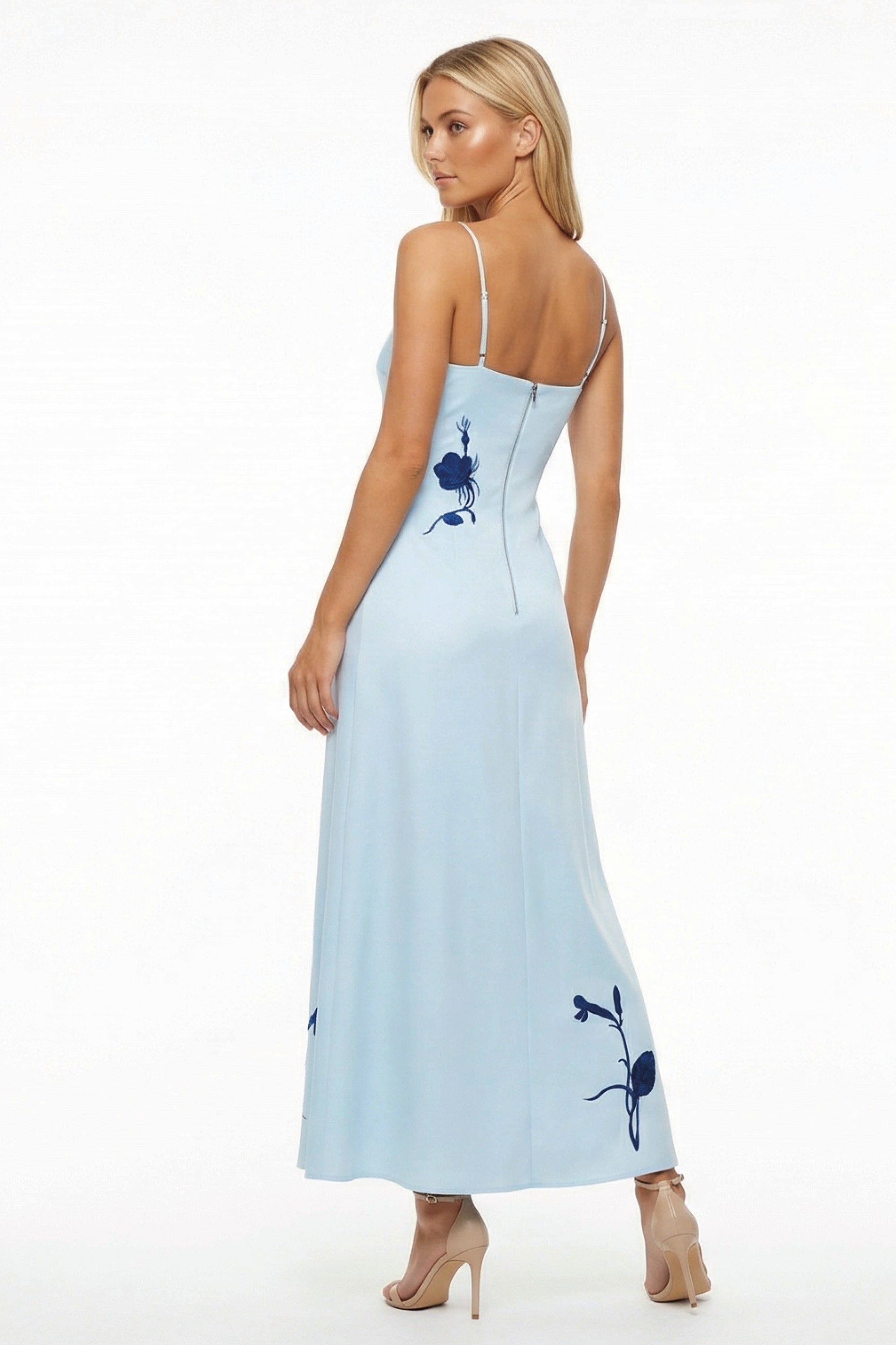 Back view of the Fanm Mon Carmen Dress showcasing the flowing silhouette, adjustable straps, and embroidered floral detailing.