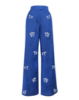 Fanm Mon Cassi Pant in Indigo 
blue with white horse embroidery and a high-rise wide-leg silhouette