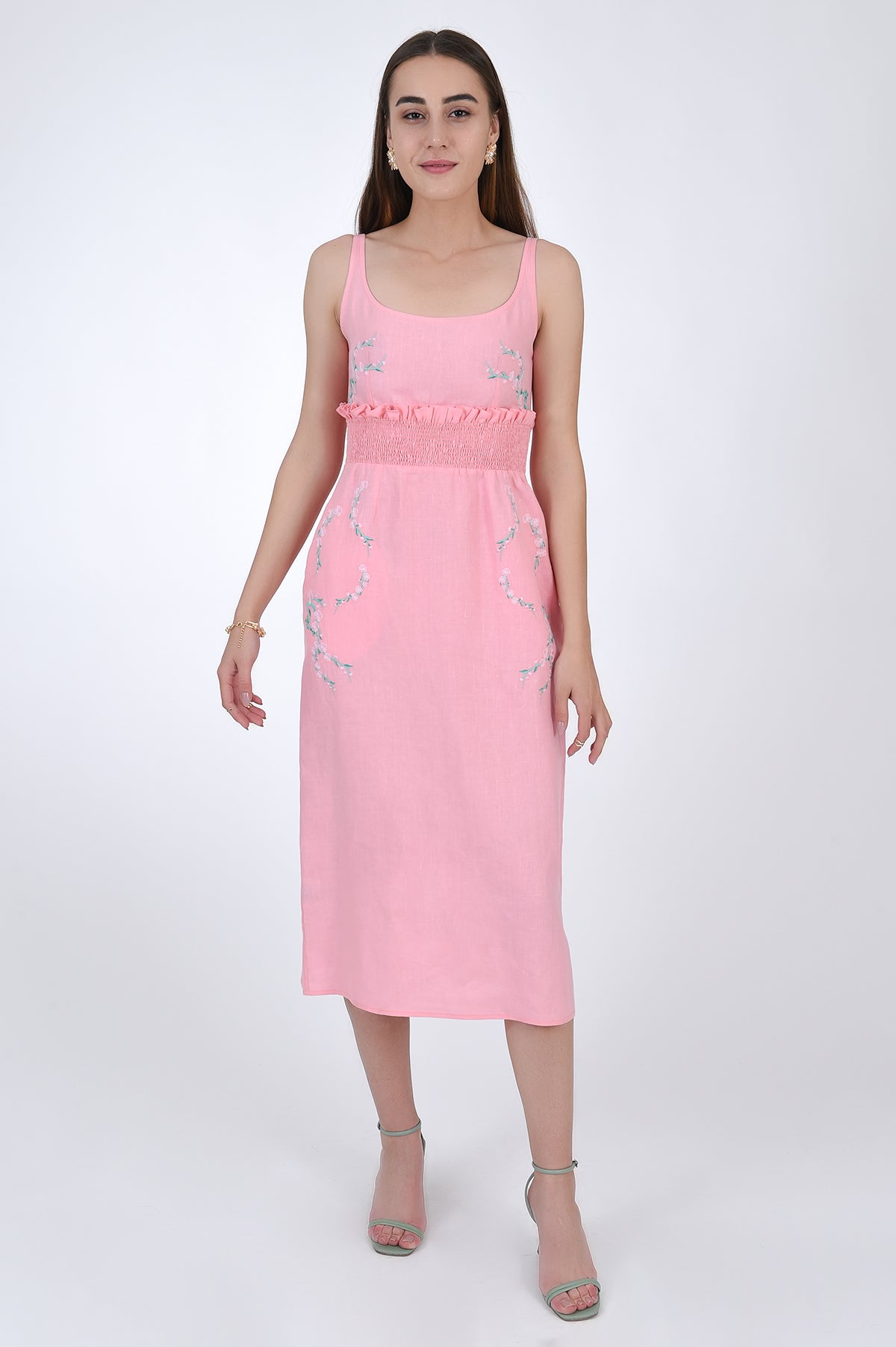 Bahar Midi Linen Sheath Dress. Featuring a smocked waistband with ruffle trim and a hand-embroidered floral pattern.