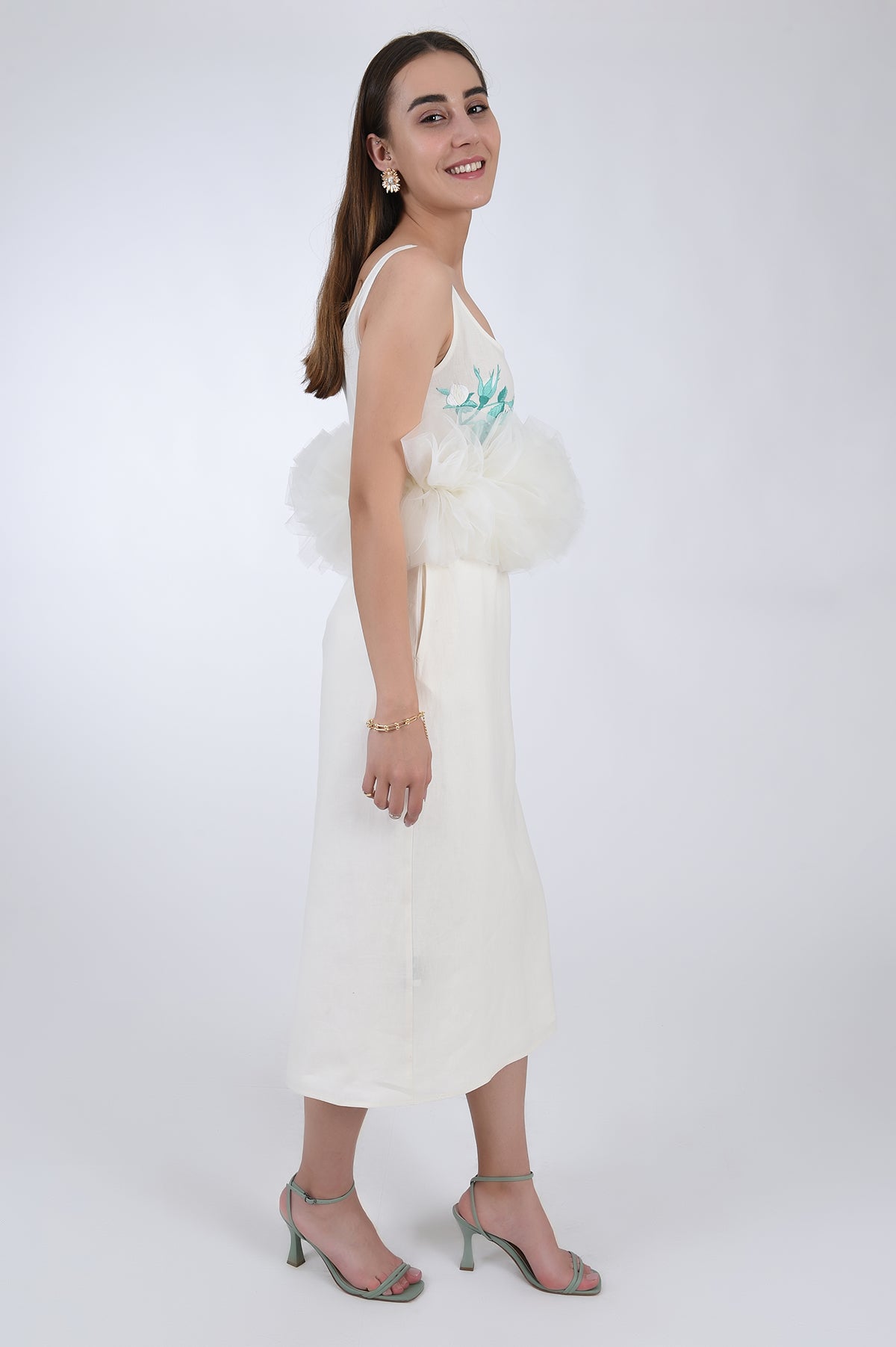 Fanm Mon Citra Linen &amp; Tulle Midi Dress, side view. Featuring embroidery detail at the chest, and tulling at the waist.  